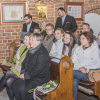 władze gminy w ławkach kościelnych podczas koncertu