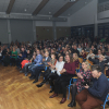 Publiczność siedząca w auli